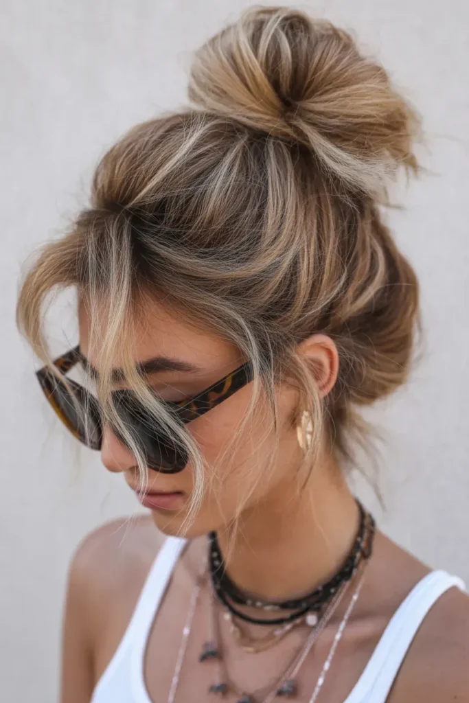High Messy Bun with Face Framing Strands